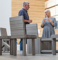 Prof. Gilles Laurent, managing director of the Max Planck Institute for Brain Research and Christiane Cuticchio, director of Atelier Goldstein discussing infront of the memorial sculpture, Never Forget.
